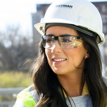 Woman with hardhat and glasses